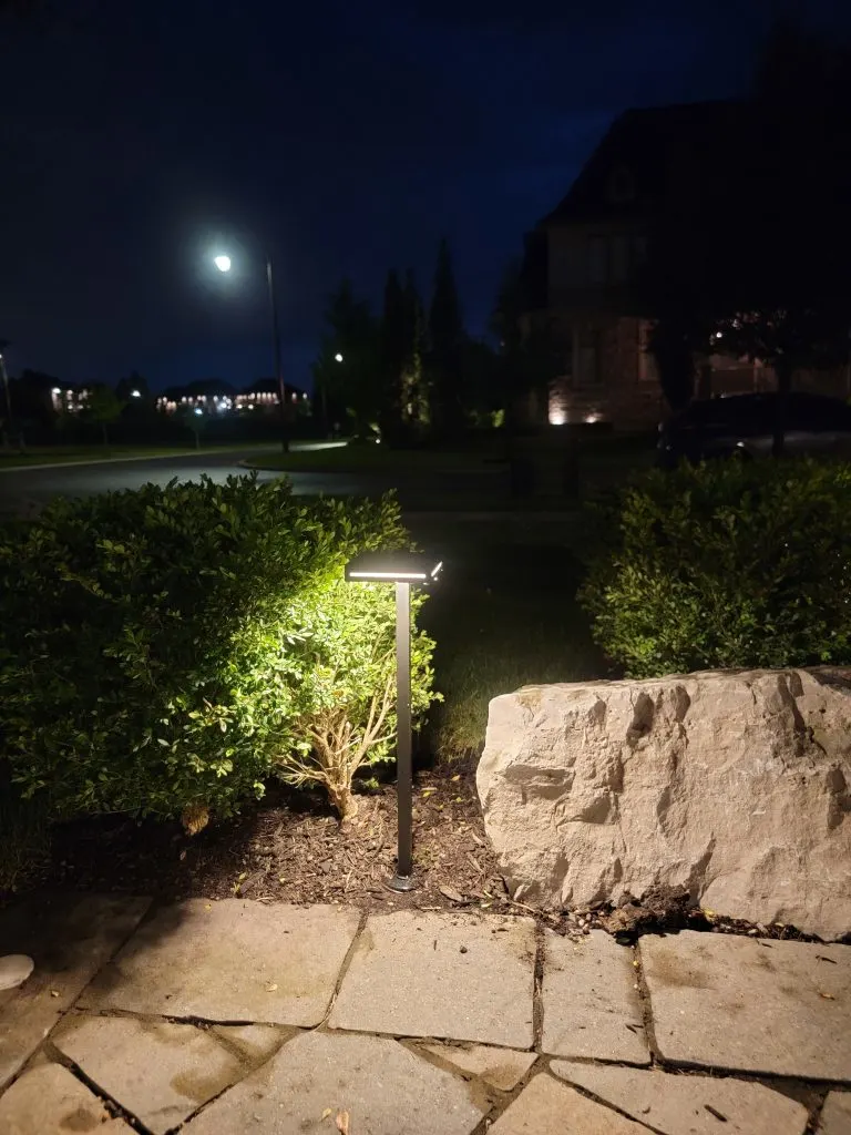 Stone façade accented by warm uplights – Vaughan home at dusk